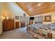 Spacious bedroom with wood ceiling, large windows, and a cozy, rustic feel at 3065 Piney Ridge Rd, Evergreen, CO 80439