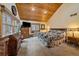 Spacious bedroom with a wall-mounted television and sliding glass doors leading to a private balcony at 3065 Piney Ridge Rd, Evergreen, CO 80439