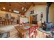 Comfortable dining room featuring hardwood floors and a cozy wood-burning stove at 3065 Piney Ridge Rd, Evergreen, CO 80439