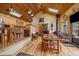 Charming dining room with vaulted wood ceiling and wood-burning stove at 3065 Piney Ridge Rd, Evergreen, CO 80439