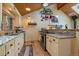 Bright kitchen featuring granite countertops, stainless steel appliances, and hardwood floors at 3065 Piney Ridge Rd, Evergreen, CO 80439