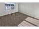 Carpeted bedroom with a large window at 1256 S Zeno Cir # E, Aurora, CO 80017