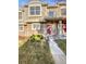 Charming townhome with a well-manicured lawn and stone facade at 1256 S Zeno Cir # E, Aurora, CO 80017