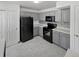 Kitchen with gray cabinets, modern appliances, and mosaic backsplash at 1256 S Zeno Cir # E, Aurora, CO 80017