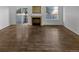 Living room with hardwood floors and brick fireplace at 1256 S Zeno Cir # E, Aurora, CO 80017