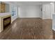 Bright living room with a fireplace and hardwood flooring, perfect for cozy evenings at 1256 S Zeno Cir # E, Aurora, CO 80017
