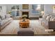 Staged living room with fireplace, lots of light and comfortable seating at 1256 S Zeno Cir # E, Aurora, CO 80017