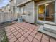 Brick patio surrounded by wood fence and house at 1256 S Zeno Cir # E, Aurora, CO 80017