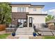 Beautifully designed backyard featuring a patio with lounge seating and a hot tub for relaxation at 1373 S Garfield St, Denver, CO 80210