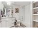Clean bathroom featuring a vanity, toilet, and tiled shower at 1373 S Garfield St, Denver, CO 80210
