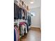 Walk-in closet features custom shelving and abundant storage for clothing and accessories at 1373 S Garfield St, Denver, CO 80210