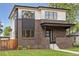 Modern two-story home with brick facade, light upper siding, and manicured lawn at 1373 S Garfield St, Denver, CO 80210