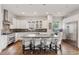 Gourmet kitchen featuring stainless steel appliances, granite countertops, and a large center island with seating at 1373 S Garfield St, Denver, CO 80210