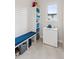 Mud Room features a built in bench and storage as well as a modern stand up freezer at 1373 S Garfield St, Denver, CO 80210