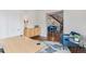 Comfortable home office with a glass table, a blue chair and light wood cabinet at 1373 S Garfield St, Denver, CO 80210