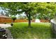 Expansive backyard with green lawn, shed, and privacy fence at 1924 Yosemite St, Denver, CO 80220