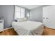 Bedroom with neutral walls, hardwood floors, and natural lighting at 1924 Yosemite St, Denver, CO 80220