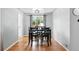 Modern dining room with hardwood floors and a square table with 4 chairs in a naturally bright room at 1924 Yosemite St, Denver, CO 80220