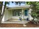 Inviting front entrance with blue potted plants and a small porch, adding curb appeal to the home at 1924 Yosemite St, Denver, CO 80220