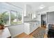 Bright kitchen with view of back yard, white cabinets, stainless appliances and granite countertops at 1924 Yosemite St, Denver, CO 80220
