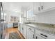 This kitchen has granite countertops, white subway tile, and stainless steel appliances at 1924 Yosemite St, Denver, CO 80220