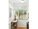 Bright kitchen nook with large windows and a view of the backyard garden at 1924 Yosemite St, Denver, CO 80220
