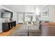 Bright living room with modern decor, featuring a sectional sofa and hardwood floors, perfect for relaxation at 1924 Yosemite St, Denver, CO 80220
