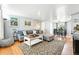 Bright living room with modern decor, featuring a sectional sofa and hardwood floors, perfect for relaxation at 1924 Yosemite St, Denver, CO 80220