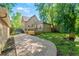 Backyard featuring a patio, grassy yard, and mature trees at 3039 W 22Nd Ave, Denver, CO 80211