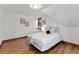 Attic bedroom featuring hardwood floors, natural light, and modern decor at 3039 W 22Nd Ave, Denver, CO 80211