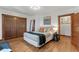 Bedroom featuring hardwood floors, wardrobe, and view to other rooms at 3039 W 22Nd Ave, Denver, CO 80211