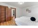 Bedroom with hardwood floors, wood trim, and view to an adjacent bedroom at 3039 W 22Nd Ave, Denver, CO 80211