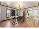 Dining room with dark wood trim, light hardwood floors and modern chandelier at 3039 W 22Nd Ave, Denver, CO 80211