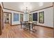Dining room with hardwood floors, dark wood trim, artwork and natural light at 3039 W 22Nd Ave, Denver, CO 80211