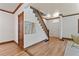 Inviting foyer featuring hardwood floors, staircase, and stylish trim at 3039 W 22Nd Ave, Denver, CO 80211
