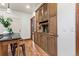 Kitchen with wooden cabinets, hardwood floors, decorative touches, and stainless steel appliances at 3039 W 22Nd Ave, Denver, CO 80211