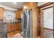 Kitchen with natural wood cabinets and stainless steel appliances at 3039 W 22Nd Ave, Denver, CO 80211