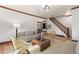 Inviting living room with hardwood floors, neutral decor, and staircase access to upper level at 3039 W 22Nd Ave, Denver, CO 80211