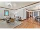 Bright living room with hardwood floors, decorative windows, and an open floor plan at 3039 W 22Nd Ave, Denver, CO 80211