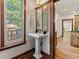 Charming powder room with pedestal sink and view of outdoor deck at 3039 W 22Nd Ave, Denver, CO 80211