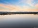 Calm water and colorful skies over community, perfect for peaceful lakeside living and scenic views at 3039 W 22Nd Ave, Denver, CO 80211