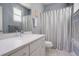 Clean bathroom with single vanity and shower/tub combo at 10256 Olathe Way, Commerce City, CO 80022