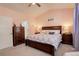 Bright bedroom with a king-size bed and dresser, offering plenty of space at 10256 Olathe Way, Commerce City, CO 80022