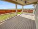Relaxing back deck featuring a ceiling fan and offering a serene outdoor living space at 14880 Chicago St, Parker, CO 80134