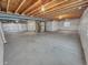 Large unfinished basement, ready for personalization, showcasing concrete floors and exposed structural elements at 14880 Chicago St, Parker, CO 80134