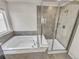 Modern bathroom featuring a tub and a glass enclosed shower at 14880 Chicago St, Parker, CO 80134