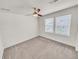 Cozy bedroom with carpet, ceiling fan, and natural light from the double windows at 14880 Chicago St, Parker, CO 80134