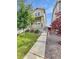 Attractive two-story home with manicured lawn, stone accents, and welcoming front porch at 14880 Chicago St, Parker, CO 80134
