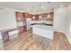 Stylish kitchen with granite countertops, stainless appliances, island, and modern lighting at 14880 Chicago St, Parker, CO 80134