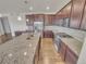 Gourmet kitchen with granite countertops, stainless steel appliances, and custom cabinetry at 14880 Chicago St, Parker, CO 80134